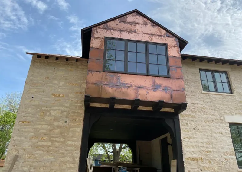 Copper metal panel facade on a stone building for Skylight Installation in Northbrook
